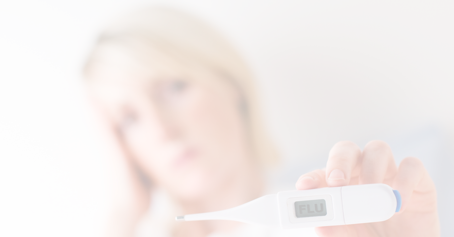 Woman with thermometer that reads flu